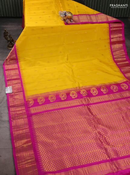Pure gadwal silk saree mango yellow and pink with zari woven buttas and temple design zari woven border