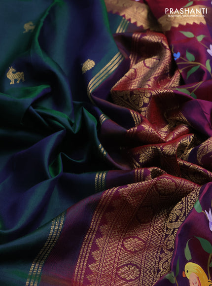 Pure Kanchipuram silk saree dual shade of greenish blue and dual shade of wine shade with zari woven annam and rettapet zari woven hand painted border & allu