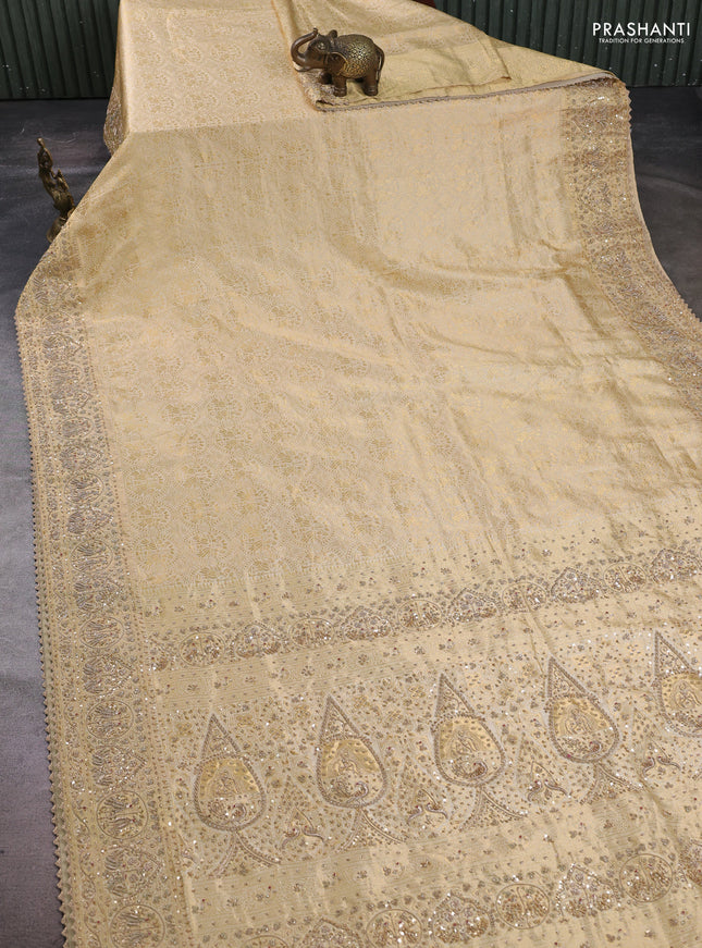 Pure Kanchipuram silk saree cream with allover zari woven brocade weaves and rich zari woven embroidery border