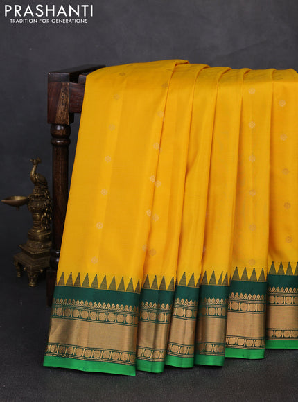 Pure gadwal silk saree yellow and dark green with zari woven buttas and temple design zari woven border
