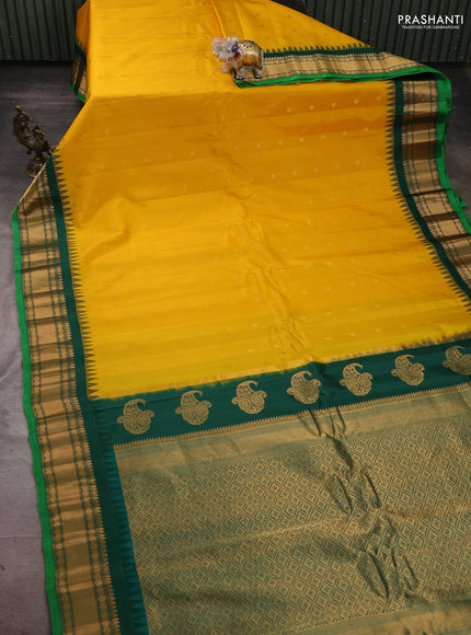 Pure gadwal silk saree yellow and dark green with zari woven buttas and temple design zari woven border