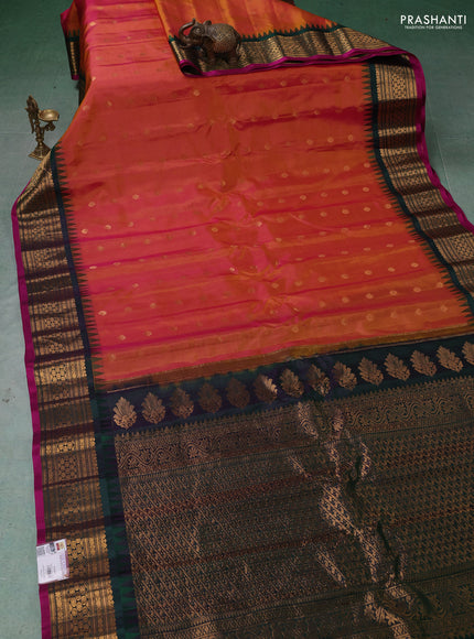 Pure gadwal silk saree dual shade of pinkish mustard and dual shade of bottle green with zari woven buttas and temple design zari woven border