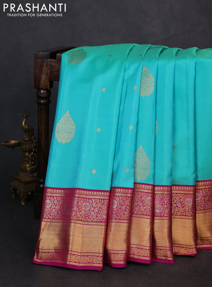 Pure gadwal silk saree dual shade of teal blue and dark magenta pink with zari woven buttas and zari woven border