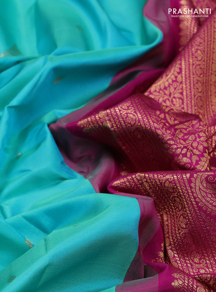 Pure gadwal silk saree dual shade of teal blue and dark magenta pink with zari woven buttas and zari woven border