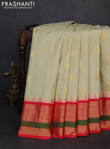 Pure gadwal silk saree mild pista green and orange with zari woven buttas and rettapet zari woven border