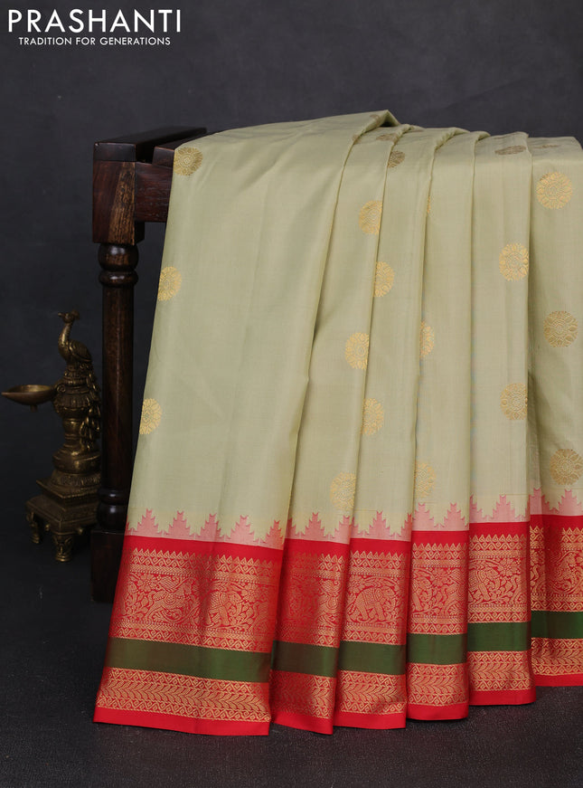 Pure gadwal silk saree mild pista green and orange with zari woven buttas and rettapet zari woven border