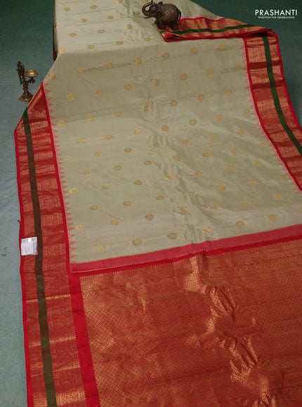 Pure gadwal silk saree mild pista green and orange with zari woven buttas and rettapet zari woven border