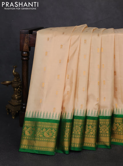 Pure gadwal silk saree cream and green with zari woven buttas and temple design zari woven border