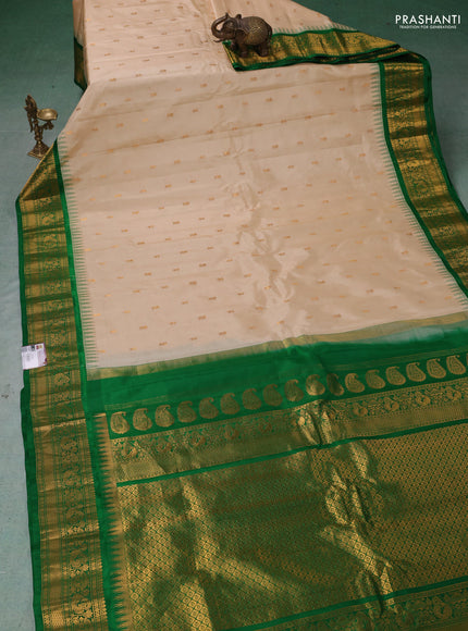 Pure gadwal silk saree cream and green with zari woven buttas and temple design zari woven border