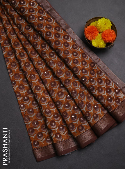Chanderi silk cotton saree dark mustard and brown with allover floral butta prints & mirror work and banarasi border