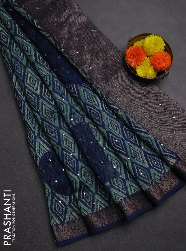 Chanderi silk cotton saree teal green and navy blue with allover ikat prints & mirror work and banarasi border