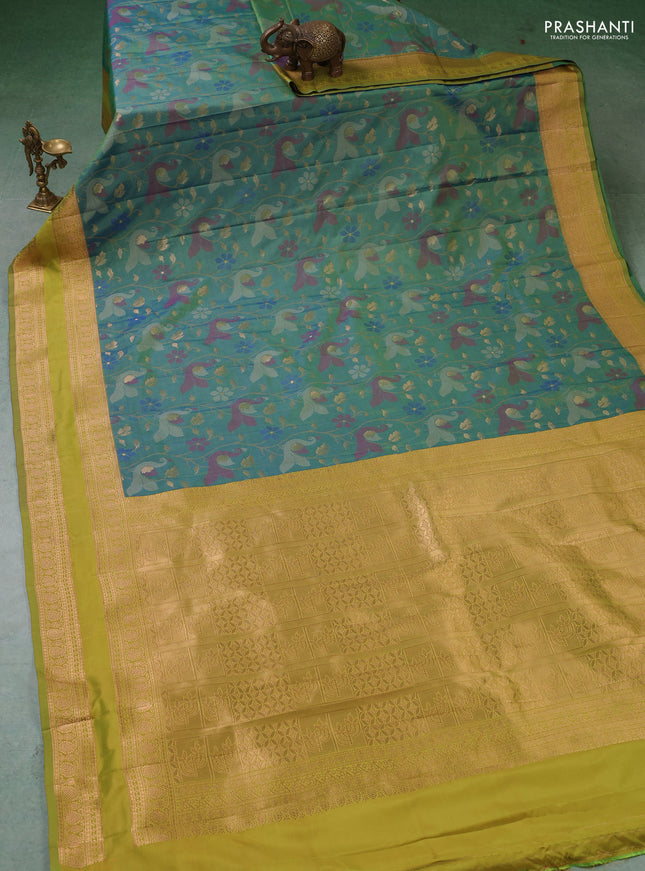 Semi kanchipuram soft silk saree dual shade of bluish green and mustard green with allover thread & zari woven buttas and rettapet zari woven border