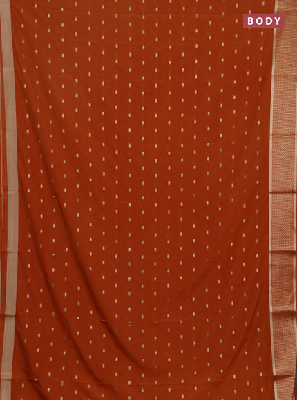 Semi mysore silk saree rust shade with allover zari woven buttas and zari woven border