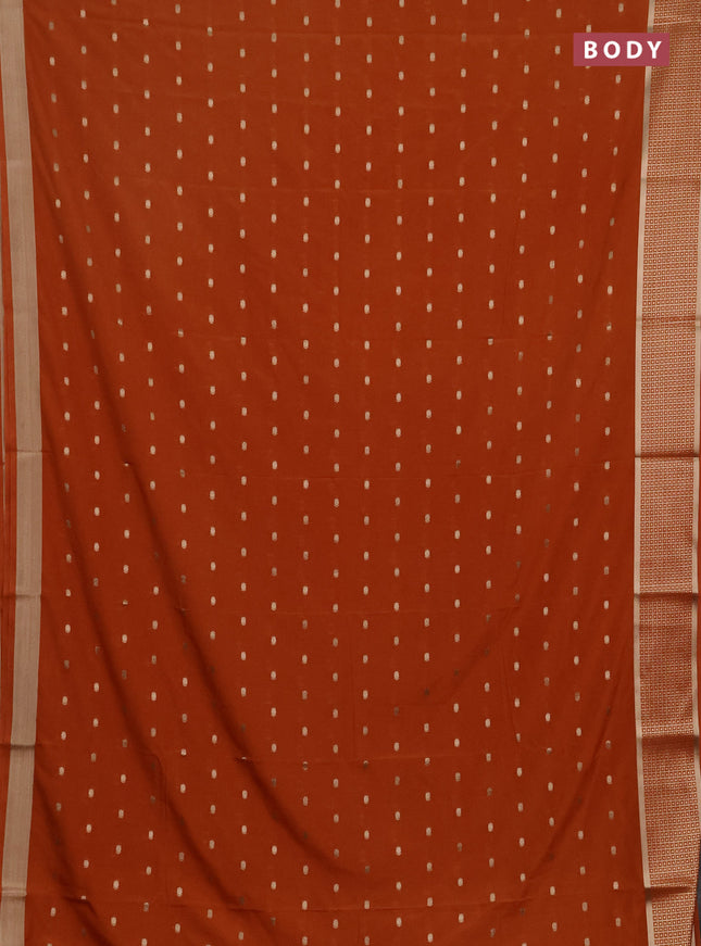 Semi mysore silk saree rust shade with allover zari woven buttas and zari woven border