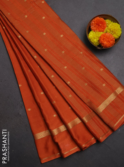 Semi mysore silk saree rustic orange with allover paisley butta prints and rettapet zari woven border