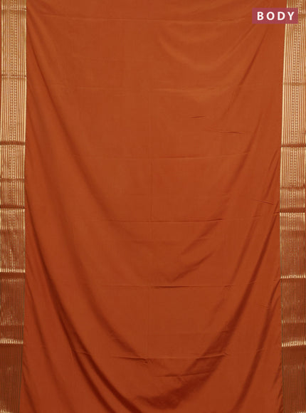 Semi mysore silk saree rustic orange with plain body and zari woven border