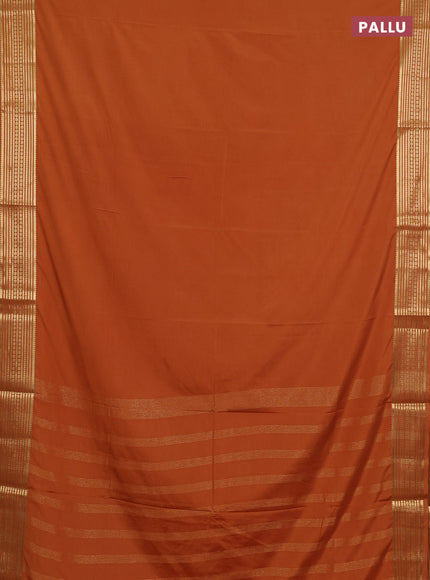Semi mysore silk saree rustic orange with plain body and zari woven border