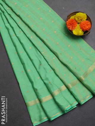 Semi mysore silk saree mild teal green with allover zari woven buttas and rettapet zari woven border