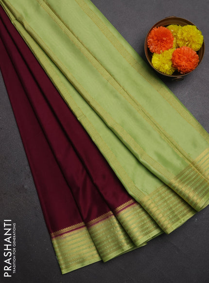 Semi mysore silk saree wine shade and light green with plain body and zari woven border