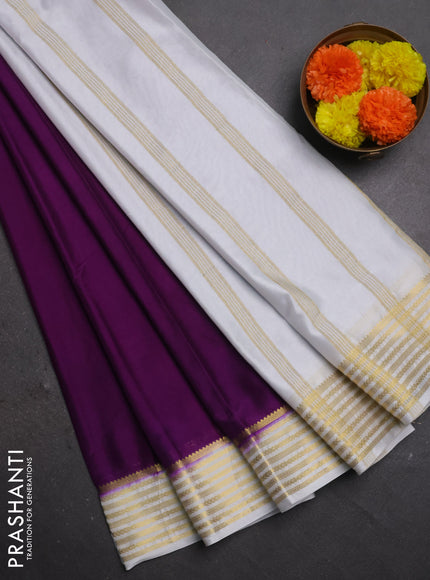 Semi mysore silk saree purple and off white with plain body and zari woven border