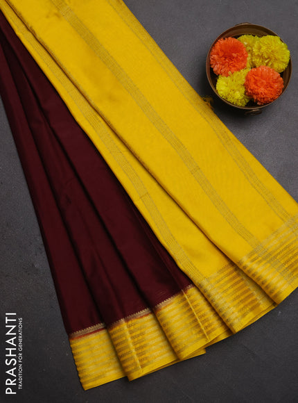 Semi mysore silk saree deep maroon and yellow with plain body and zari woven border