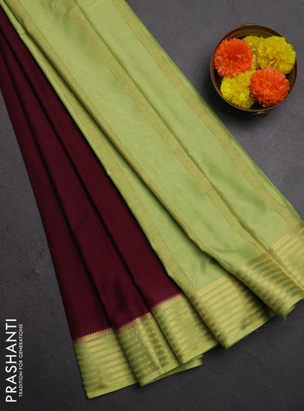 Semi mysore silk saree wine shade and light green with plain body and zari woven border