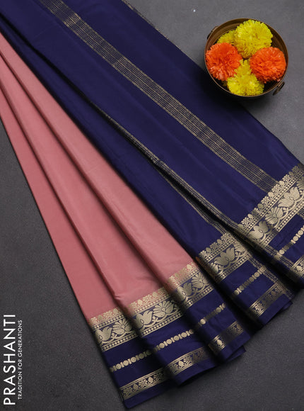 Semi mysore silk saree peach pink shade and navy blue with plain body and zari woven border