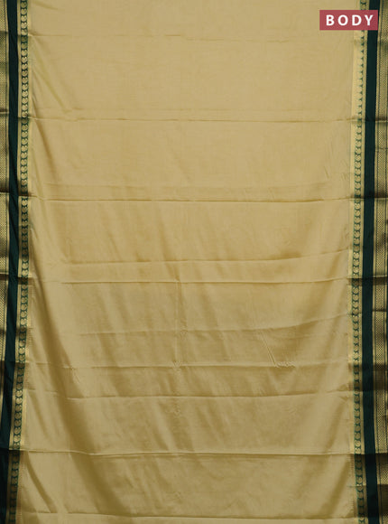 Semi mysore silk saree cream and bottle green with plain body and rettapet zari woven border