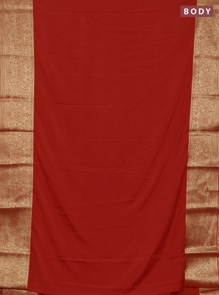 Semi mysore silk saree orange with plain body and long zari woven border