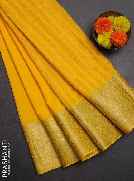 Semi mysore silk saree yellow with plain body and long zari woven border