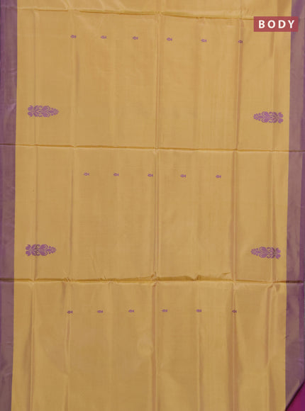 Banana pith saree pale yellow and purple with thread woven buttas and contrast border
