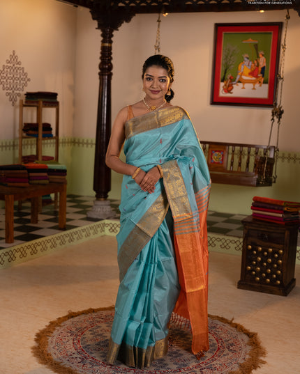 Banana pith saree teal green and rust shade with thread woven buttas and zari woven border