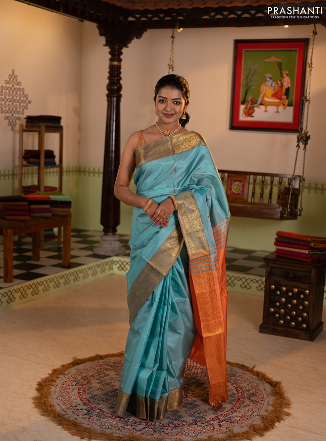 Banana pith saree teal green and rust shade with thread woven buttas and zari woven border