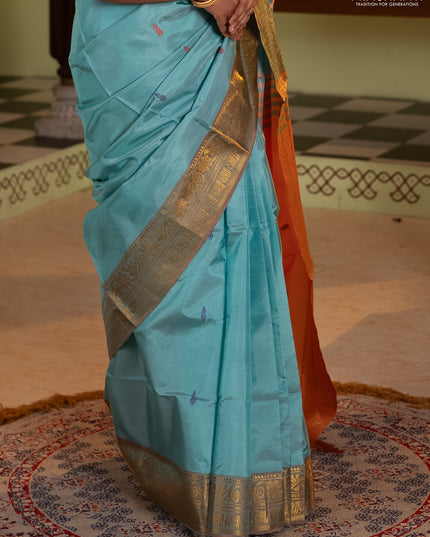 Banana pith saree teal green and rust shade with thread woven buttas and zari woven border