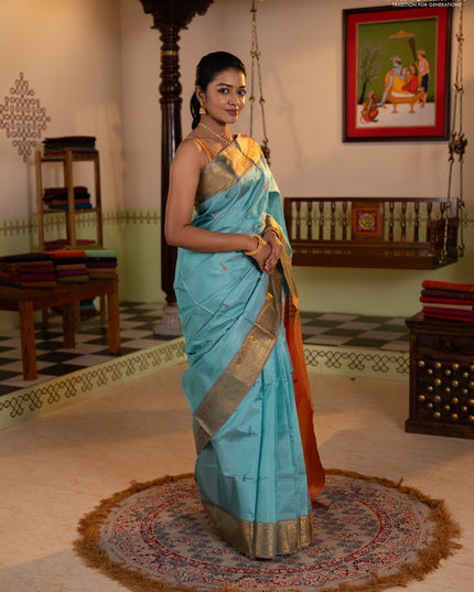 Banana pith saree teal green and rust shade with thread woven buttas and zari woven border