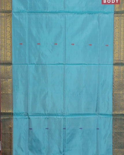 Banana pith saree teal green and rust shade with thread woven buttas and zari woven border
