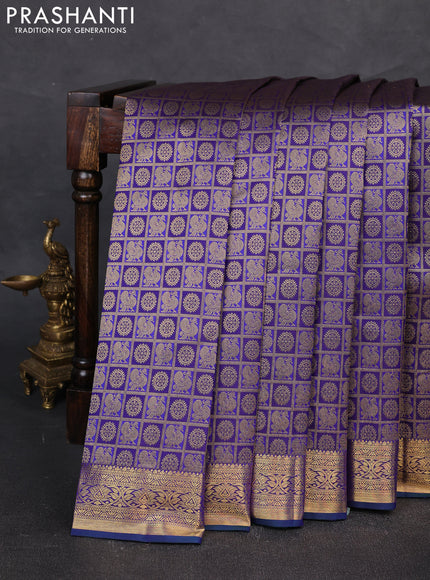 Pure kanchipuram silk saree blue with allover zari checks & buttas and rich zari woven border