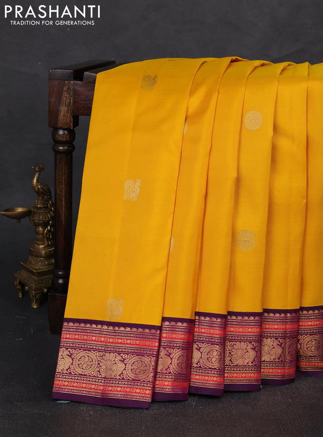 Pure kanchipuram silk saree yellow and purple with annam & rudhraksha zari woven buttas and rich zari woven korvai border