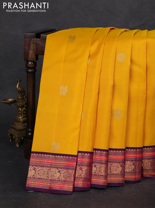 Pure kanchipuram silk saree yellow and purple with annam & rudhraksha zari woven buttas and rich zari woven korvai border