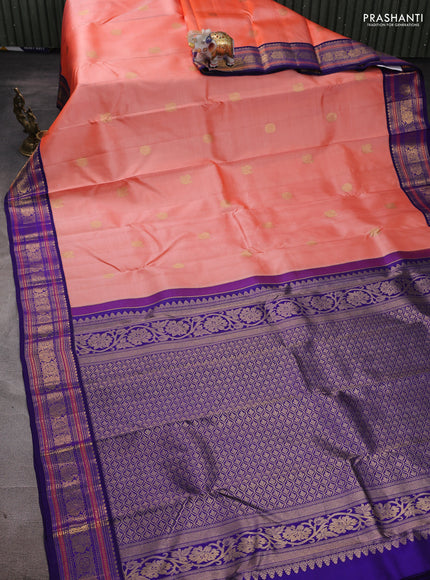 Pure kanchipuram silk saree peach orange and blue with annam & rudhraksha zari woven buttas and rich zari woven korvai border