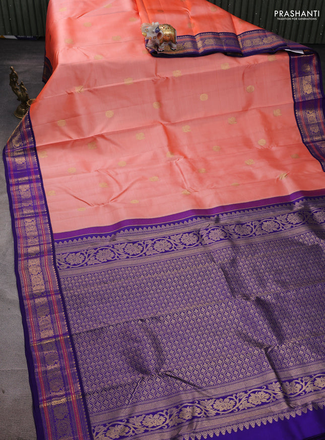 Pure kanchipuram silk saree peach orange and blue with annam & rudhraksha zari woven buttas and rich zari woven korvai border