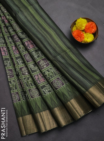 Semi matka saree green and bottle green with allover patola prints and zari woven border