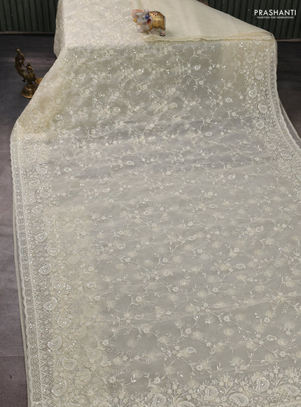 Organza Saree cream with allover embroidery work
