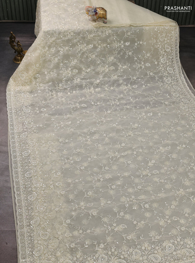 Organza Saree cream with allover embroidery work