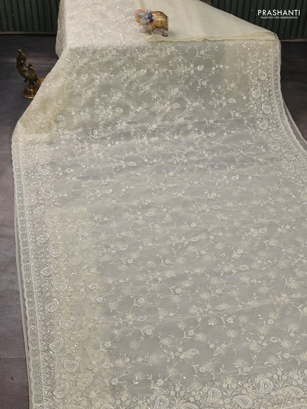 Organza Saree cream with allover embroidery work
