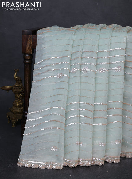 Crush tissue silk saree pastel green with allover sequin embroidery work