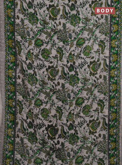 Kalamkari semi silk saree beige and green with allover prints and printed border