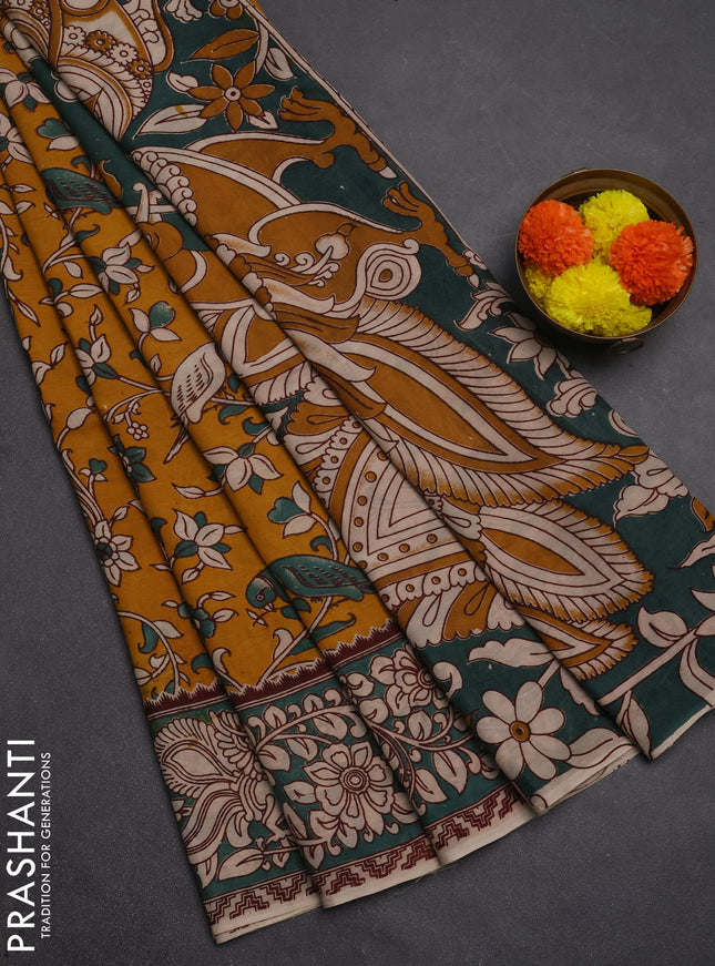 Kalamkari semi silk saree mustard yellow and gree shade with allover prints and printed border