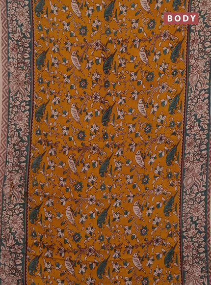 Kalamkari semi silk saree mustard yellow and gree shade with allover prints and printed border