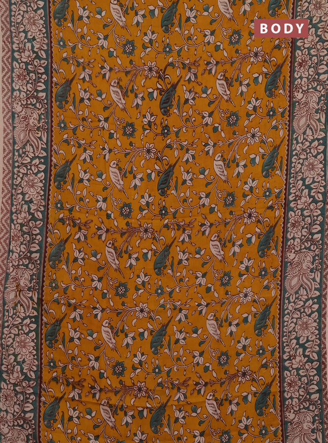 Kalamkari semi silk saree mustard yellow and gree shade with allover prints and printed border